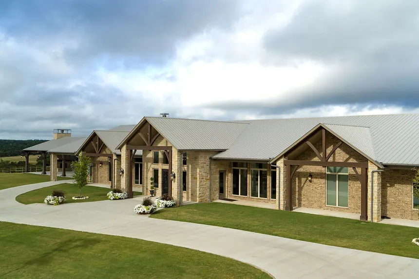 Howard Ranch custom Hill Country estate in Driftwood, TX — stone and timber architecture on landscaped acreage